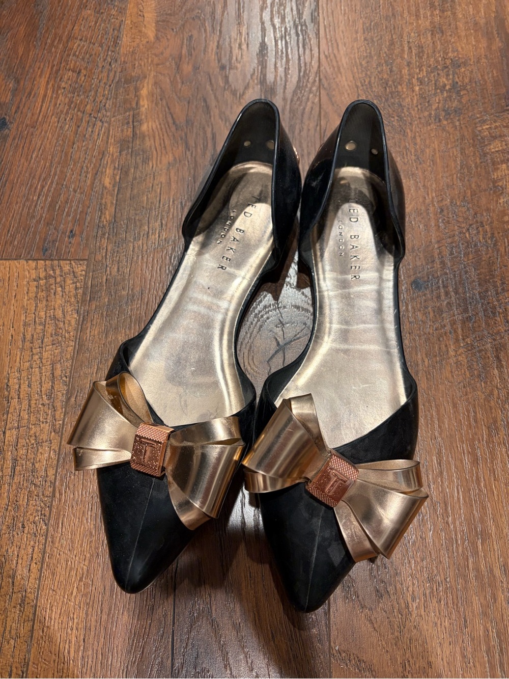 Ted Baker Black Pointed Flats with Gold Bow Accent